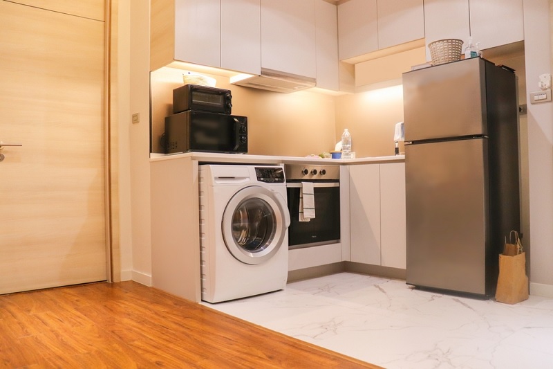 Fridge near oven in kitchen