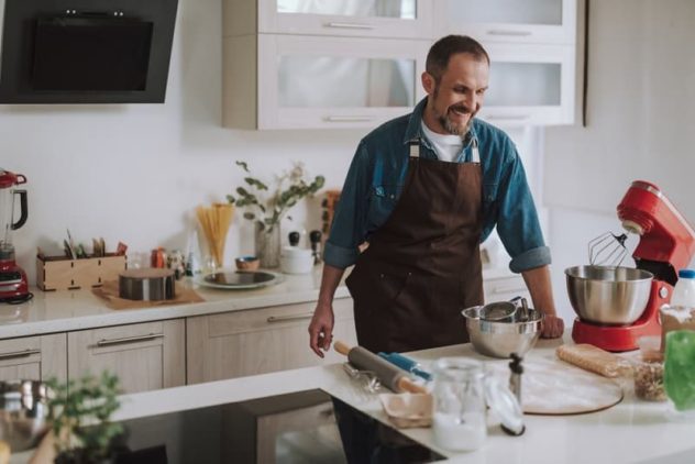 Man using stand mixer in home kitchen