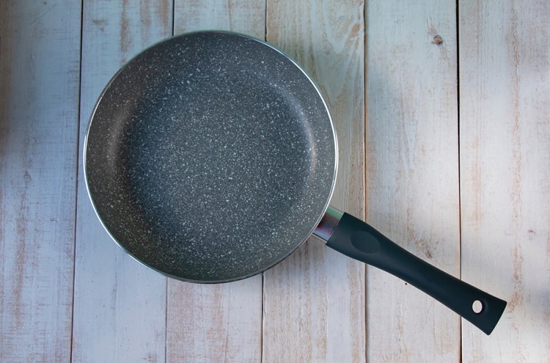 Ceramic pan on wood