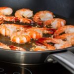 Frying shrimp in skillet
