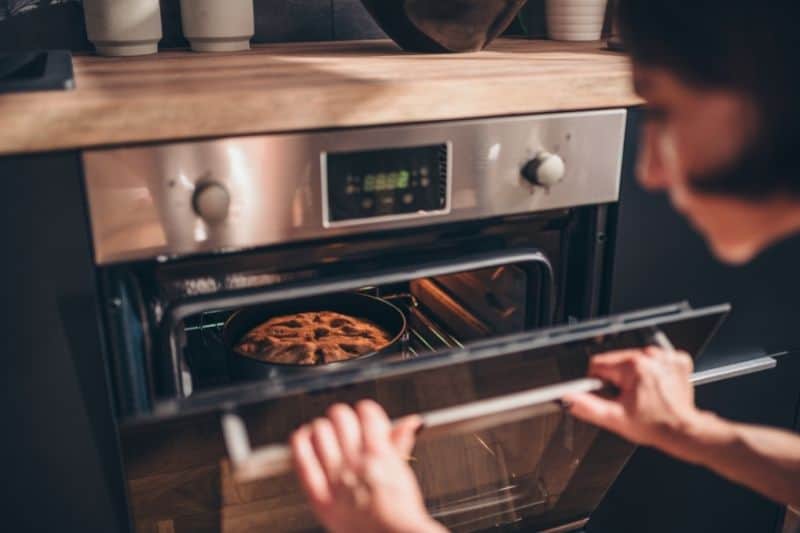 Woman Checking the Oven