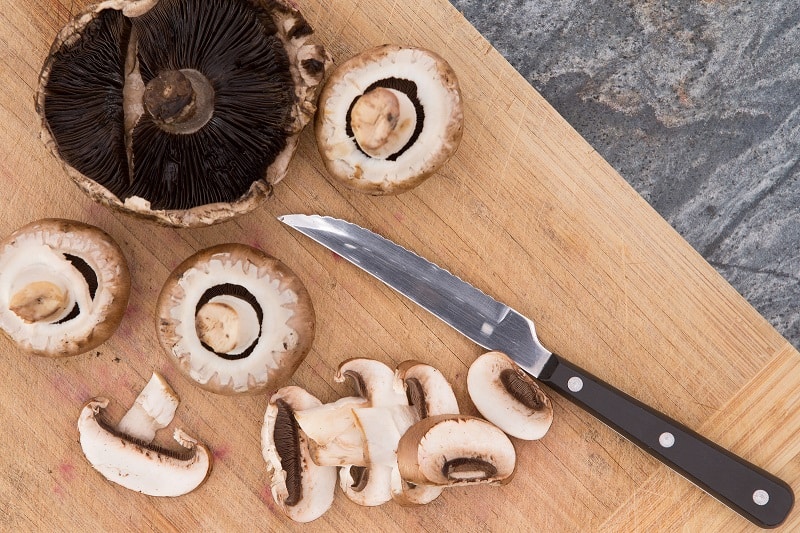 Mushrooms on chopping board