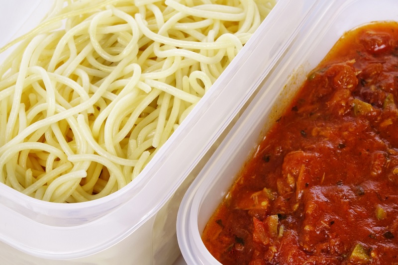 Pasta and sauce in plastic tubs
