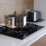 Stainless steel pan on gas hob