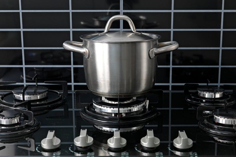 Stainless steel pot on gas hob