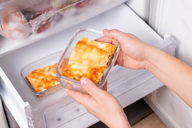 Taking small frozen lasagne out of freezer