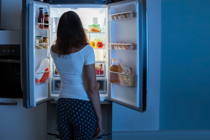 woman opening the fridge