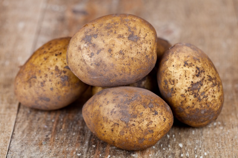 Potatoes on wood surface