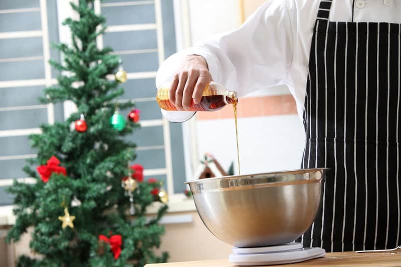 Pouring golden syrup into bowl