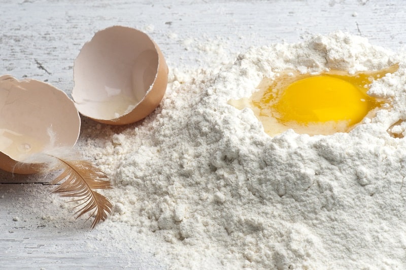 Mixing egg and flour for baking