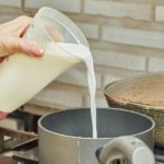 Pouring milk into pan