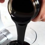 Pouring molasses from jar