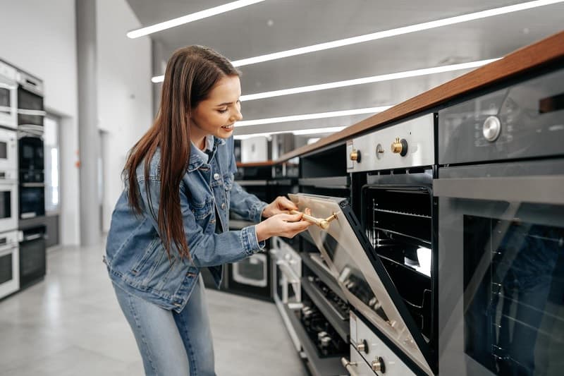 Woman shopping for an oven