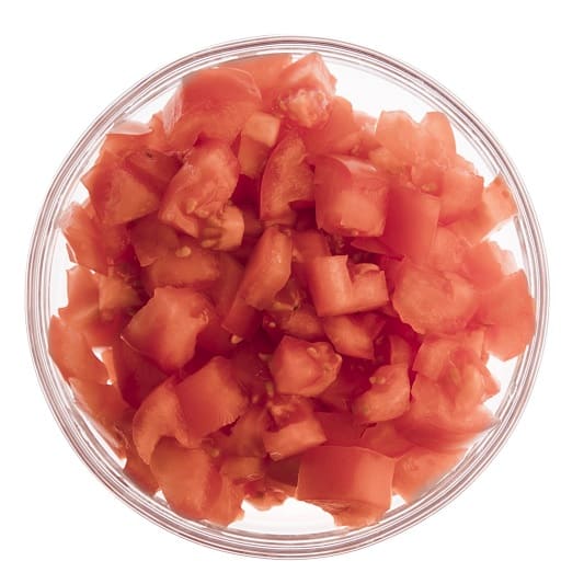 Chopped tomatoes in glass bowl