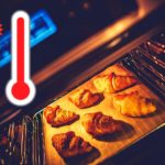 Hot oven with croissants in