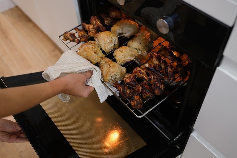 Taking food out of oven grill